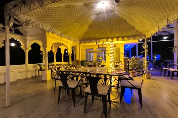 The covered terrace at Jaajam glowing after dark